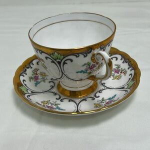 Elegant Gold and White Floral Teacup and Saucer Set